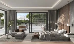 Dormitorio moderno con cama king, sofá, mesa auxiliar y acceso a terraza. La iluminación y distribución crean un ambiente de feng shui.